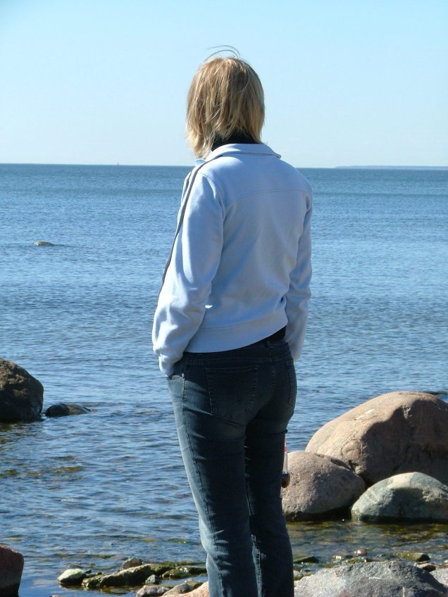 Lady looking out onto ocean